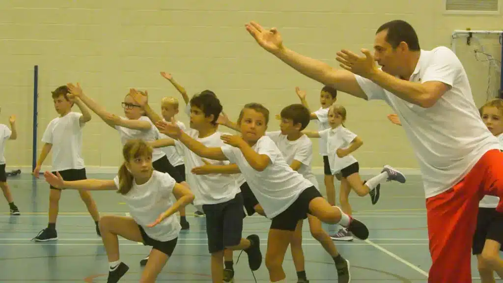Children exercising gymnasium group activity.